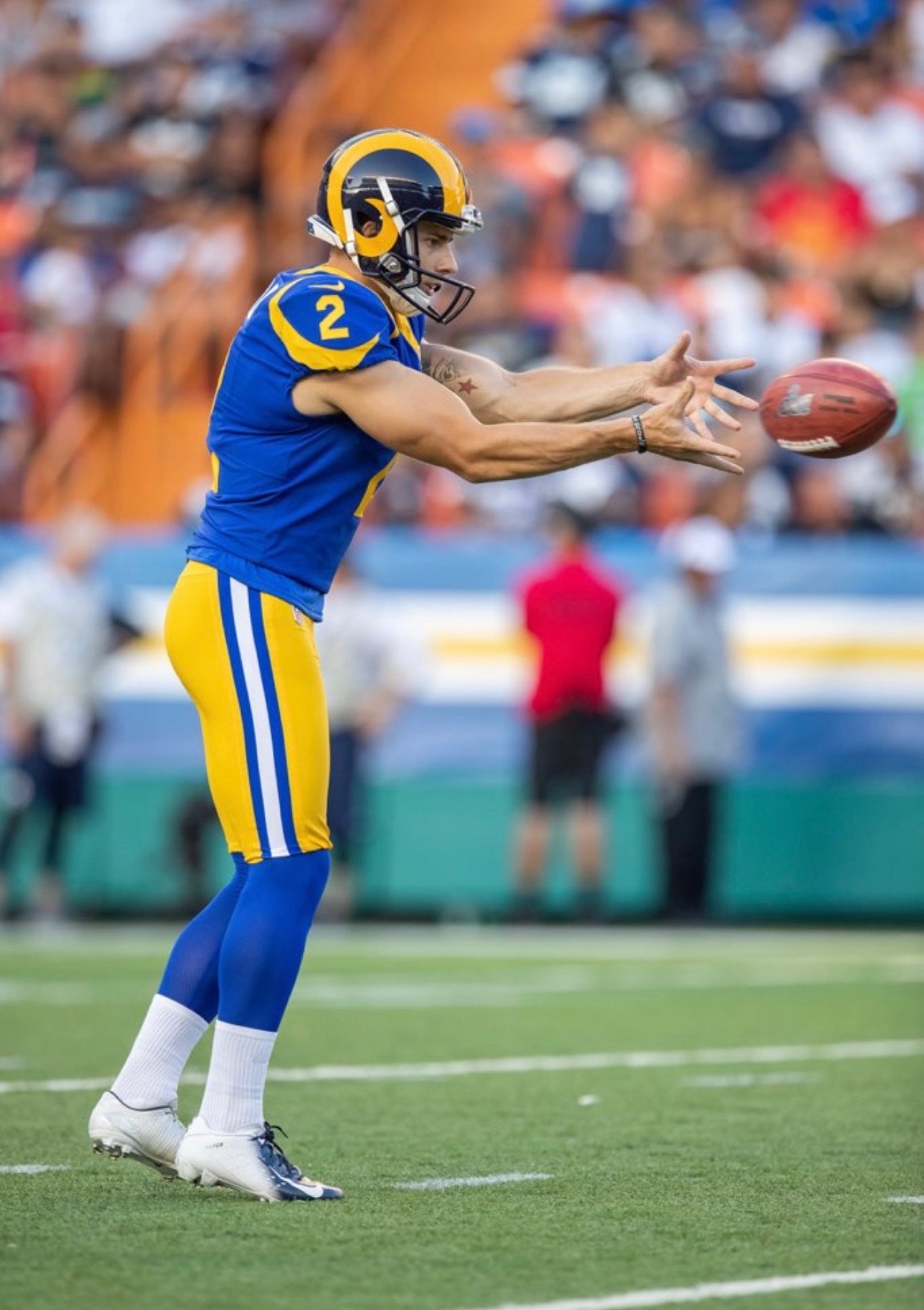 Brock Miller catching a snap in warmups as a professional punter